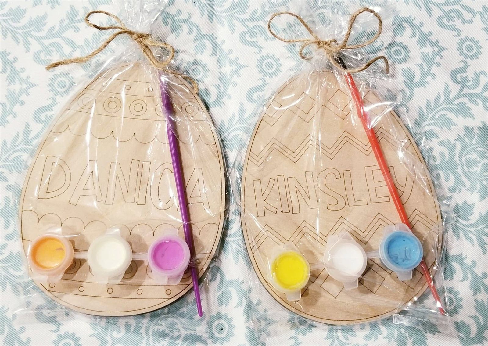 Packaged SIS DIY egg kits with paints and brushes