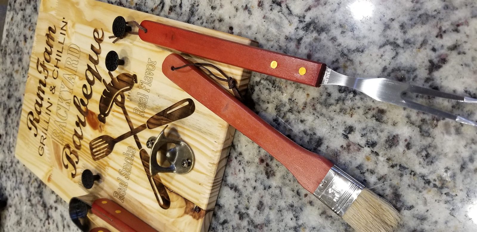 Laser engraved backyard barbecue board with grilling tools