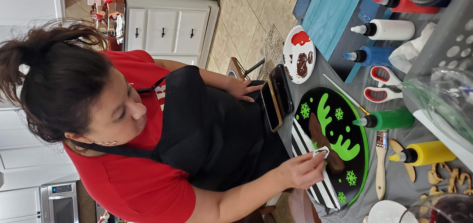 Guest painting a holiday reindeer project